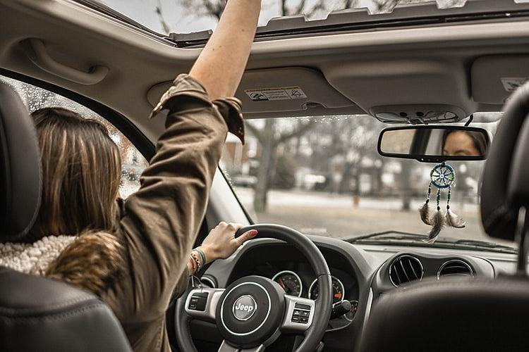 Photo Of Woman Driving Car 1051071